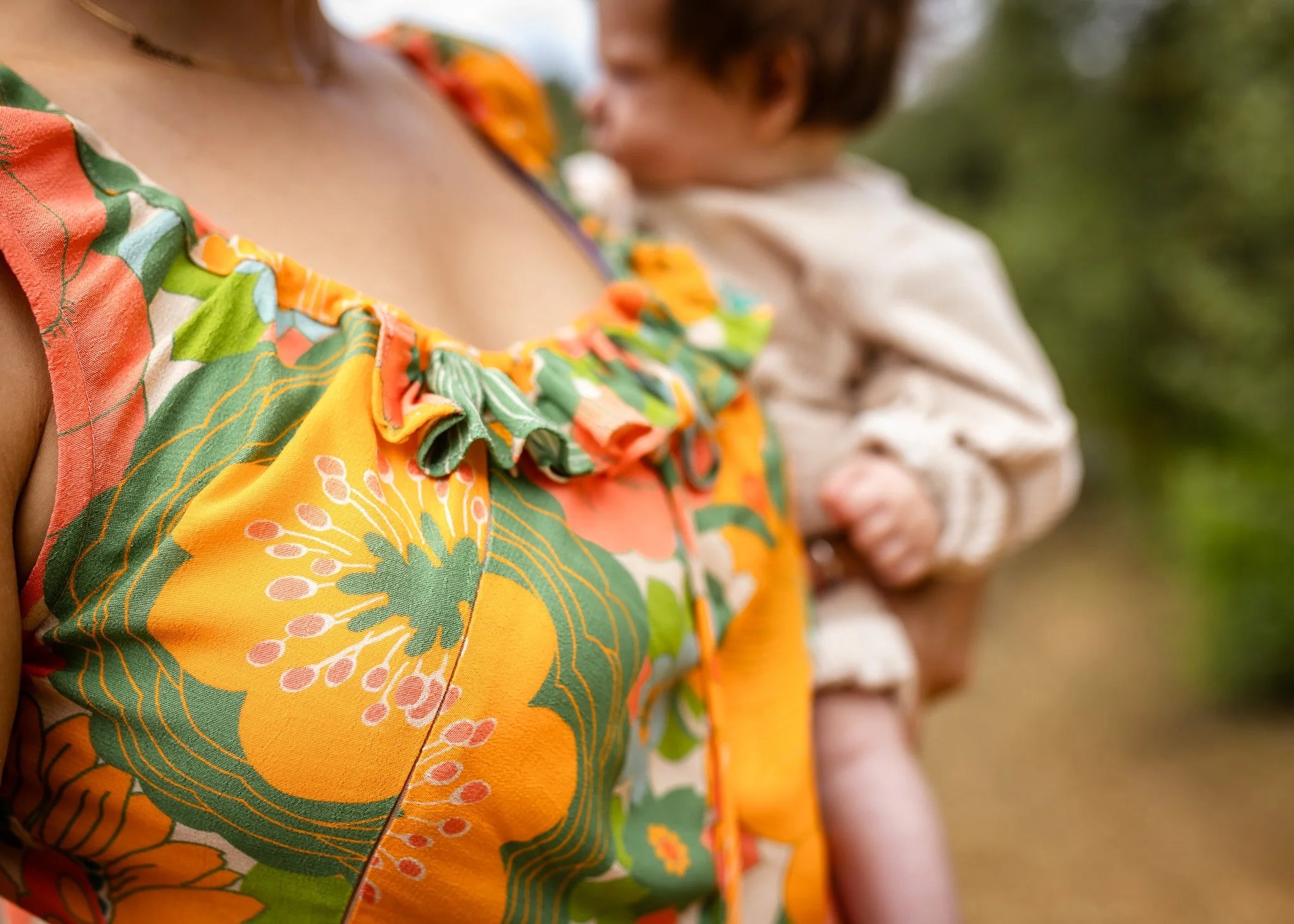 Dali Midi Dress — postpartum model wearing bold print, maternity and nursing dress | Nomadic Mother | Latchette