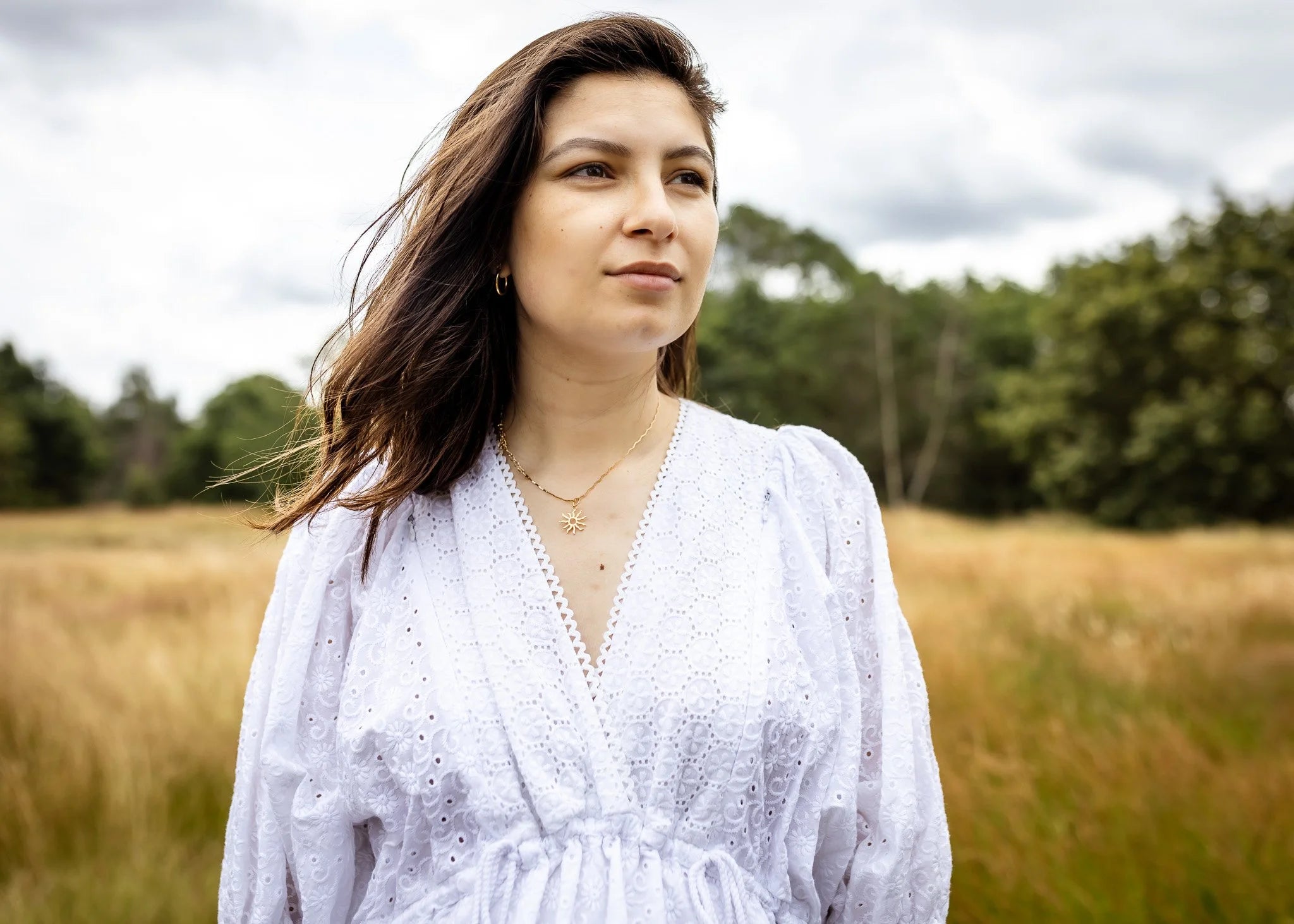 Sofia Maxi Dress white broderie — model wearing dress with gold necklace, with crossover V neck | Nomadic Mother | Latchette