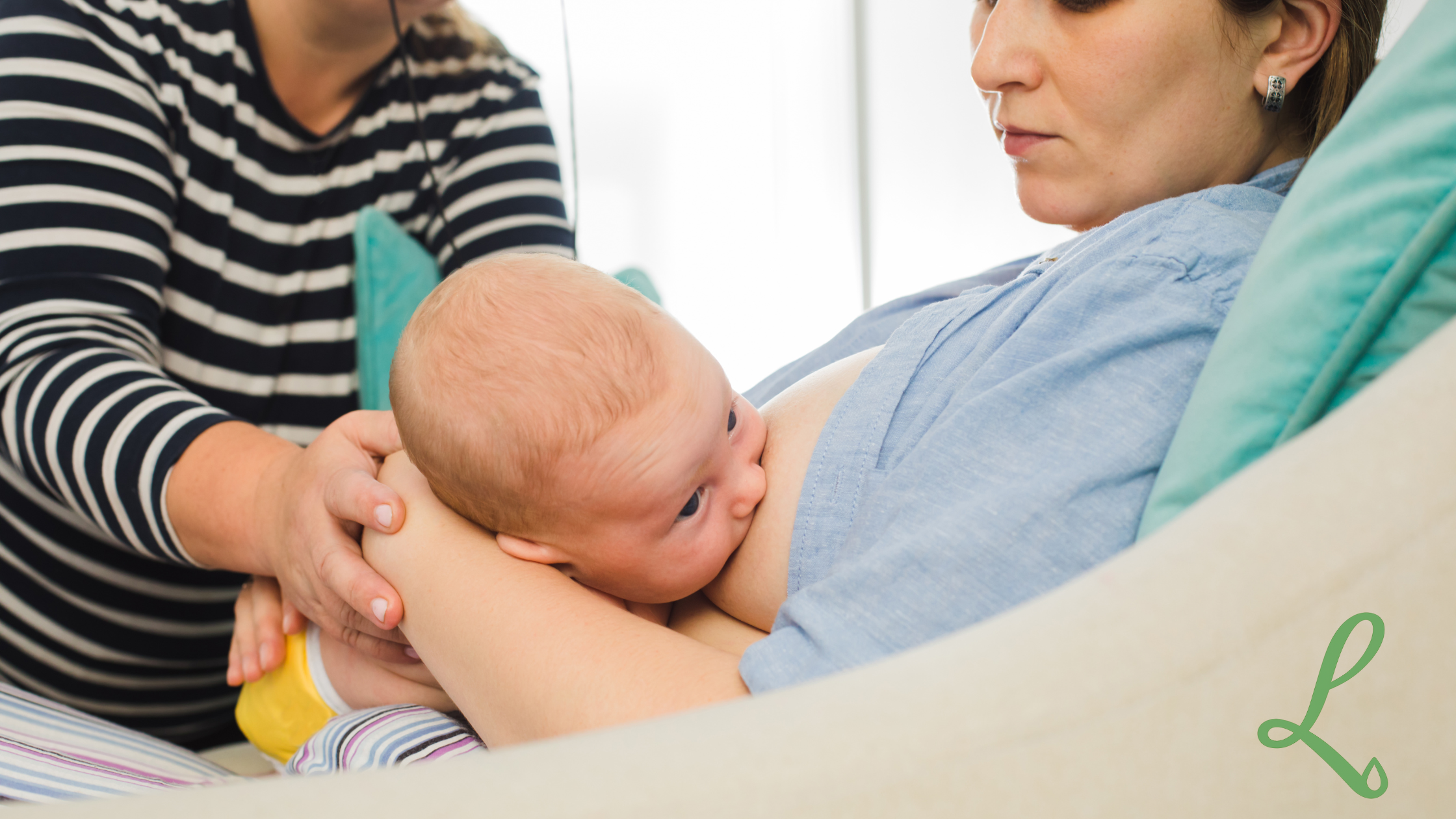 mum breastfeeding a baby with someone helping 