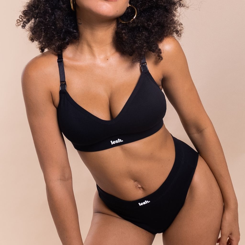 woman wearing a black bra and a black underwear