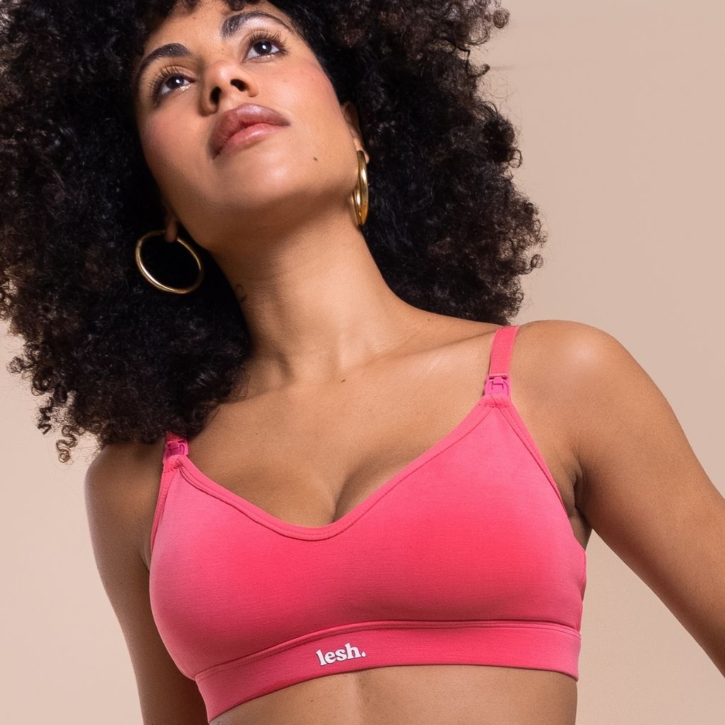 Woman wearing a neon pink nursing bra