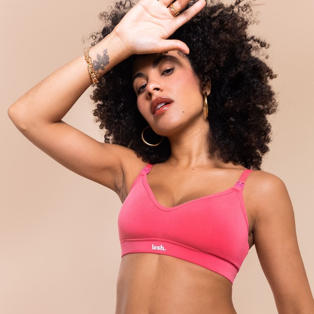 Woman wearing a neon pink nursing bra