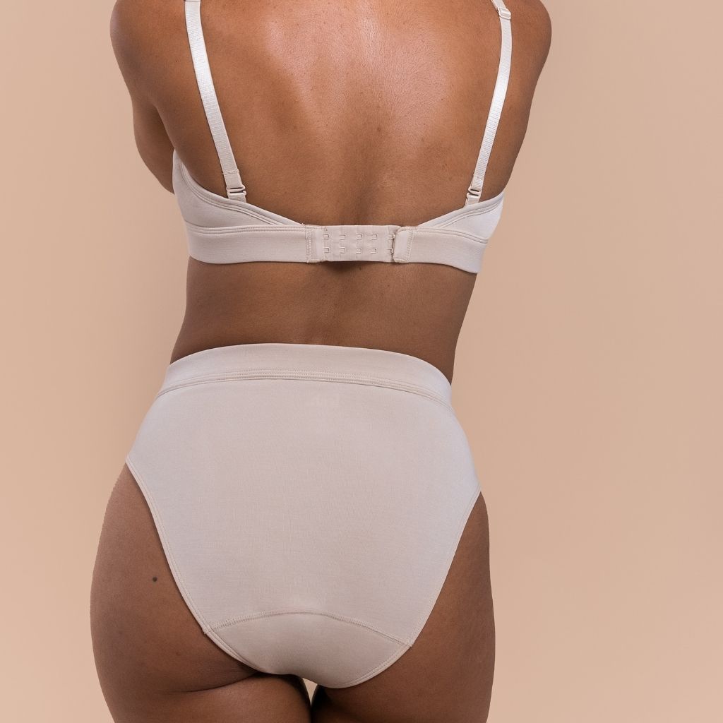 Beige lingerie set on a beige background