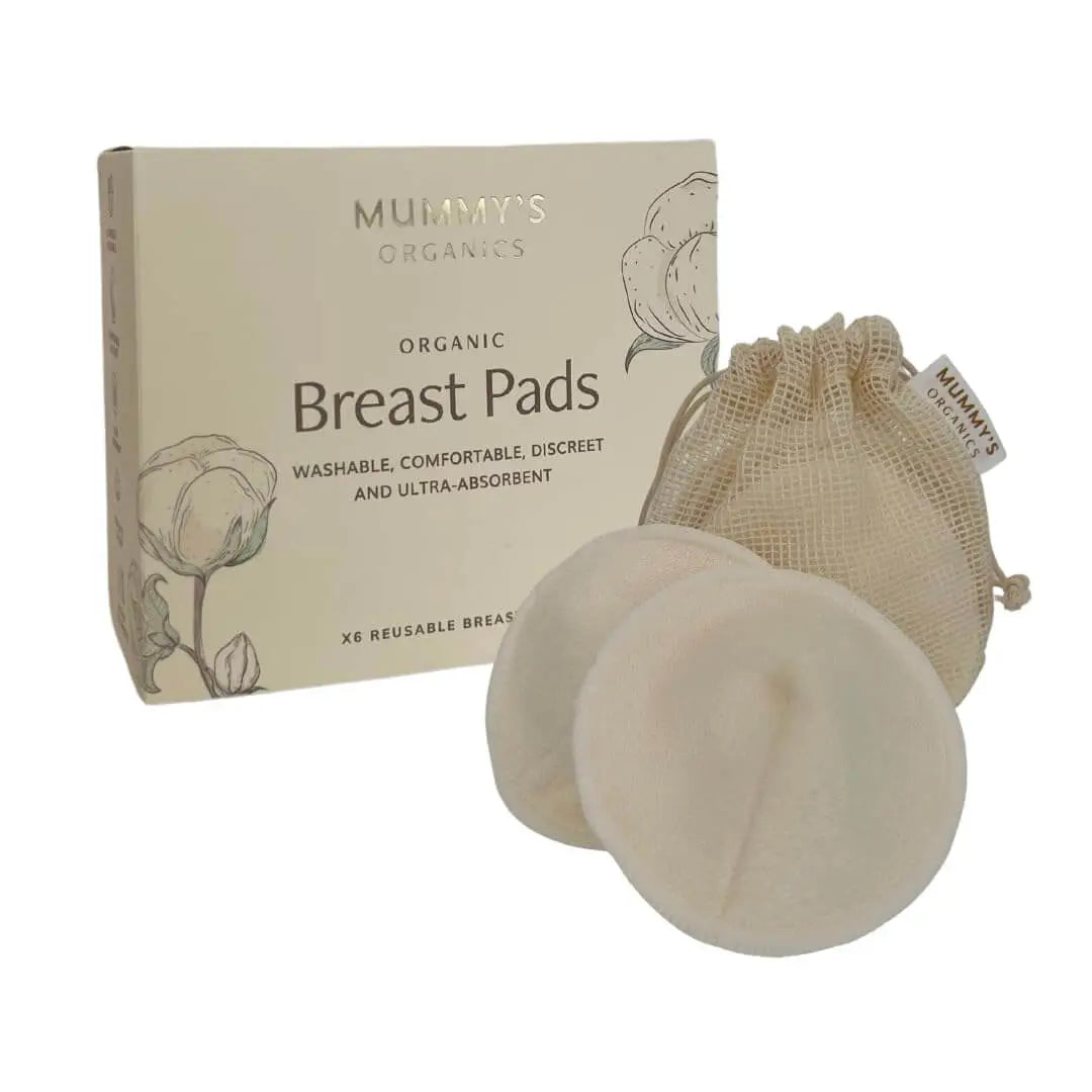 A pack of Mummy's Organics organic breast pads with six washable, reusable pads displayed alongside a netted cotton wash bag and product packaging with illustrations of cotton and flowers.