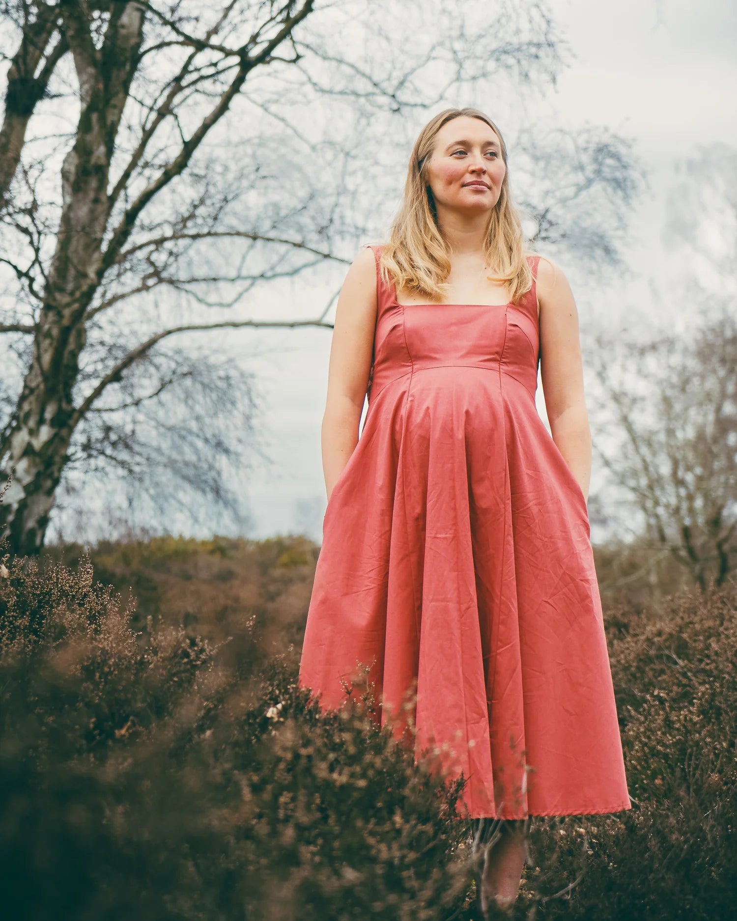 Megan Midi Dress terracotta — lifestyle shot worn on holiday, maternity nursing midi dress | Latchette