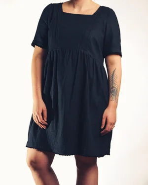 Poppy Mini Dress in black linen mix — model wearing, maternity and nursing mini dress | Nomadic Mother | Latchette
