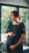 Poppy Mini Dress black linen mix — lifestyle shot, maternity and nursing dress worn postpartum | Latchette