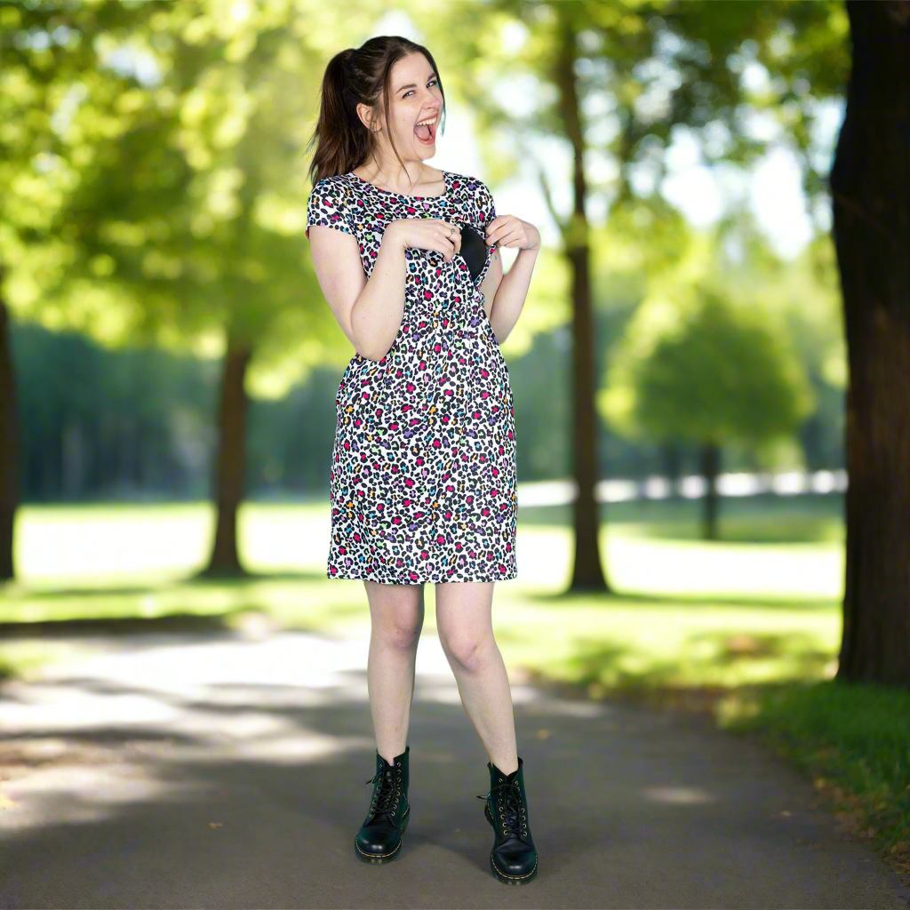 Woman in a floral dress standing in a park